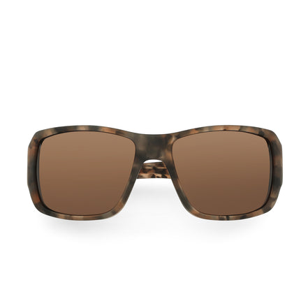 Sunglasses with tortoiseshell frame and brown lenses on a white background