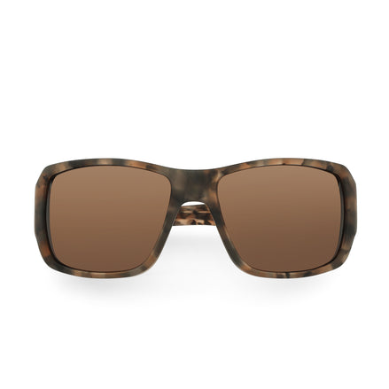 Sunglasses with tortoiseshell frame and brown lenses on a white background